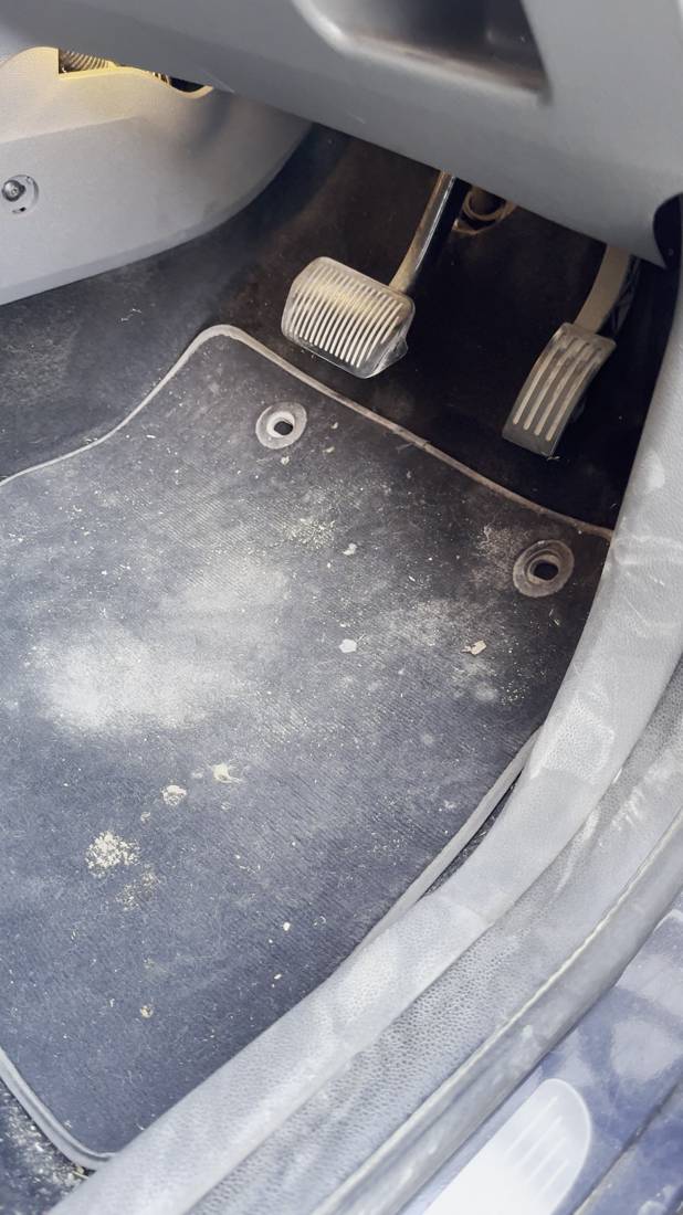 Dusty, stained Ford carpet before detailing